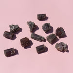 Mineral samples on a pink background