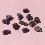 Mineral samples on a pink background