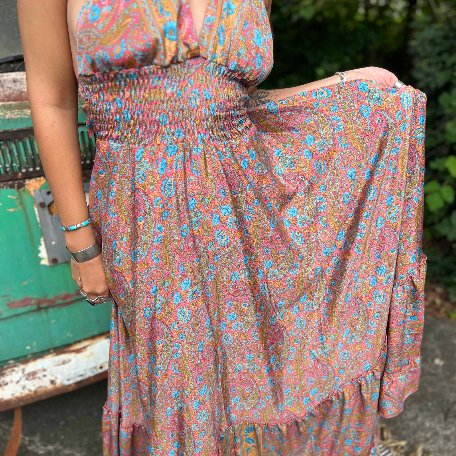 Person wearing a floral dress with a blurred background