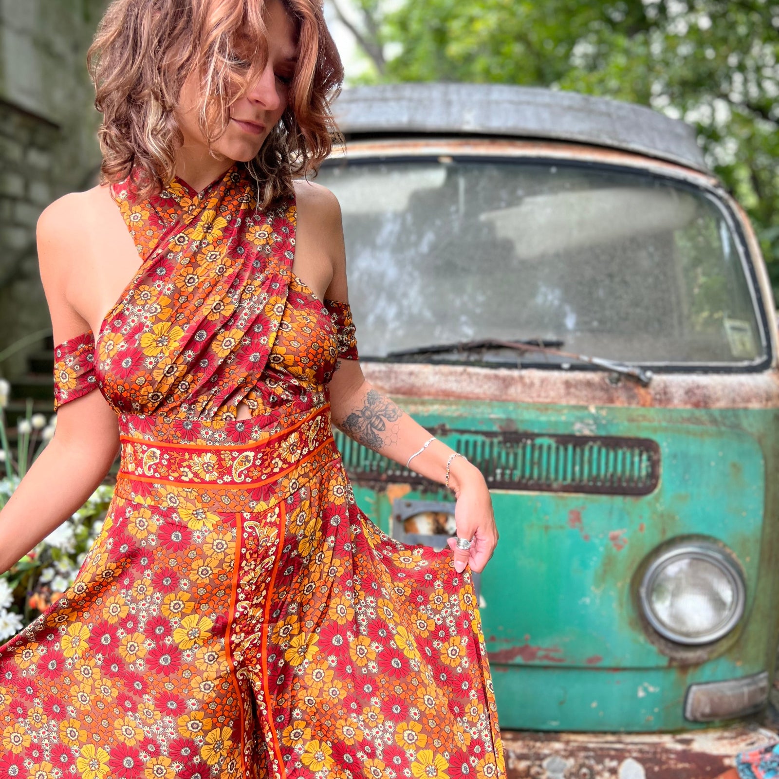 Multi-way rainbow jumpsuit tied in criss-cross halter style