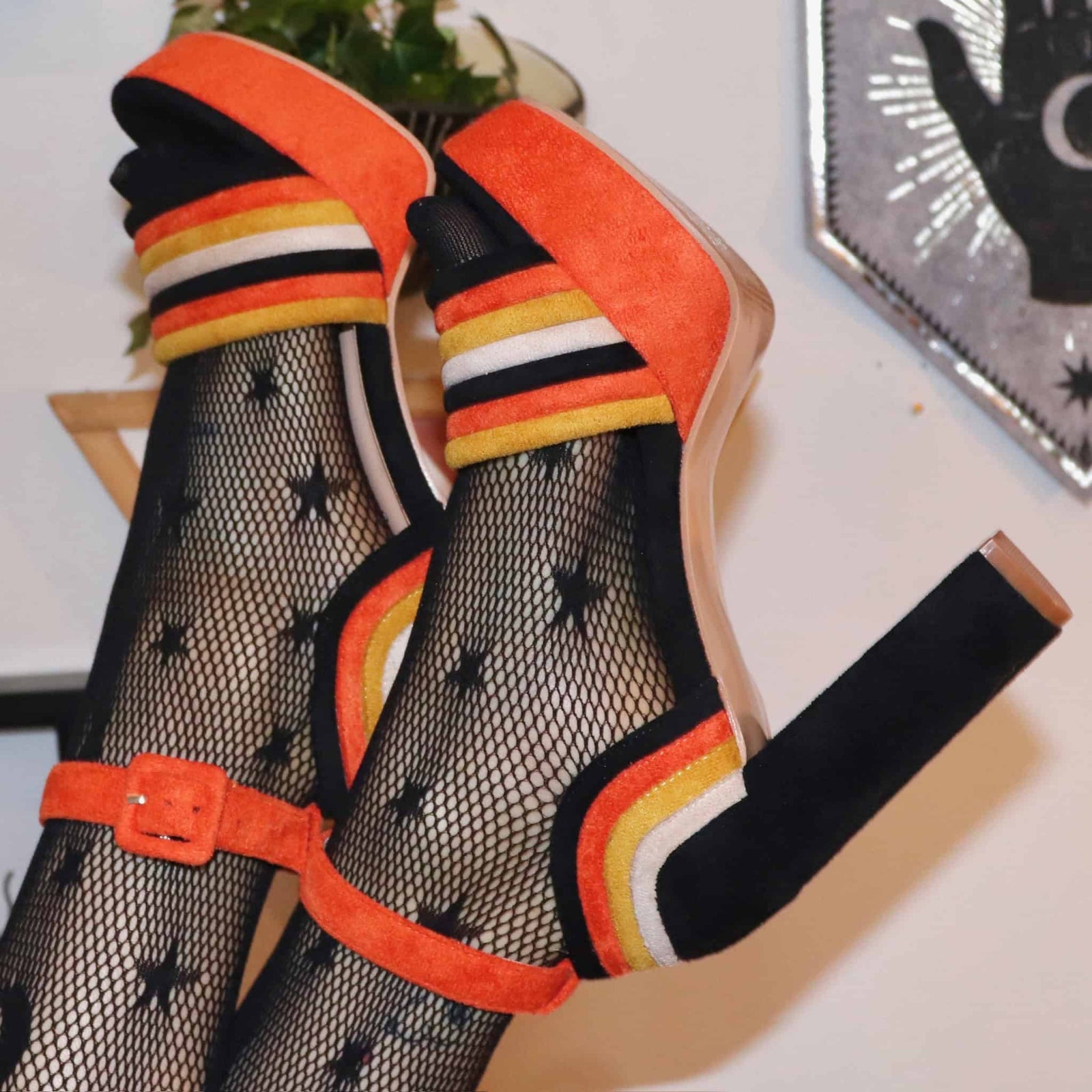 Orange, yellow, and black suede pumps for Halloween outfits.