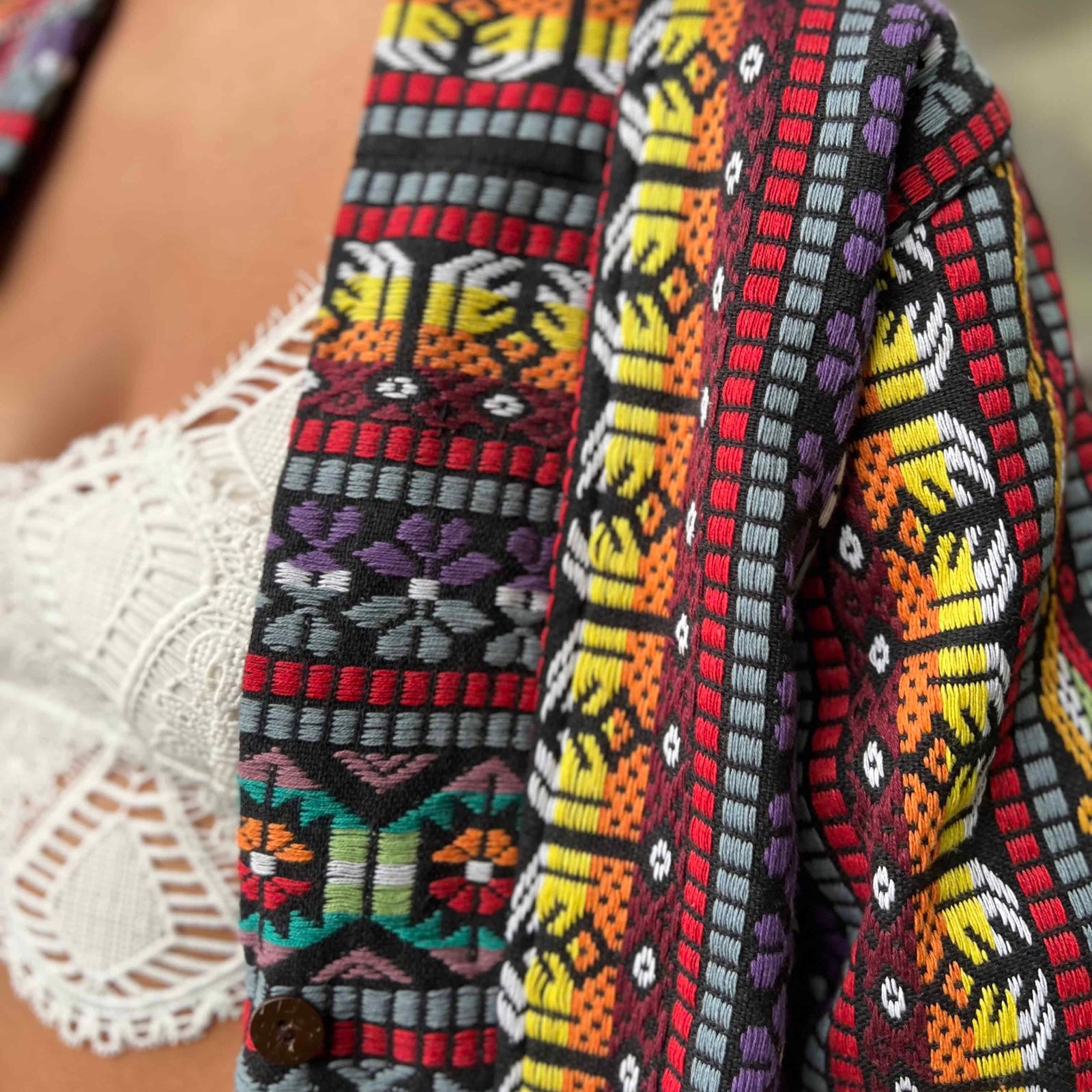 Handcrafted detail of unisex boho festival trench coat pockets