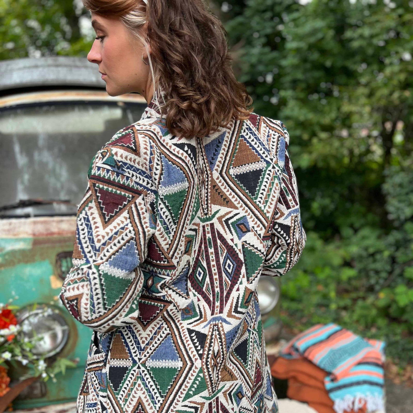 Fashion pose featuring hippie boho long unisex trench coat