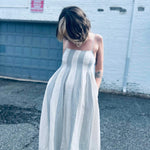 pintuck cotton midi dress styled for a casual look with pockets