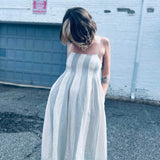 pintuck cotton midi dress styled for a casual look with pockets