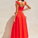 The red heaven corset flutter dress in front of a white background.