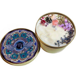 The Virgo Crystal Candle opened with the lid to the right of it on a white background.