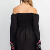 The black elephant embroidery dress on a white background.