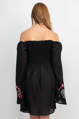 The black elephant embroidery dress on a white background.