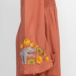 The clay elephant embroidery dress on a white background.
