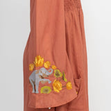 The clay elephant embroidery dress on a white background.