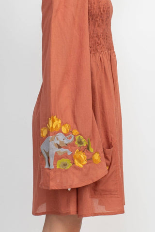 The clay elephant embroidery dress on a white background.