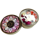 The Sagitarius Crystal Candle opened with the lid to the right of it on a white background.