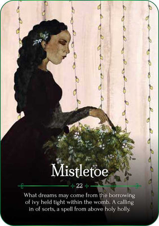 One of the oracle cards with a drawing of a black-haired woman in a burgundy dress holding a basket of mistletoe.