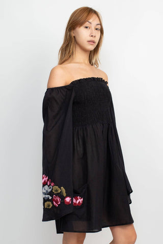 The black elephant embroidery dress on a white background.