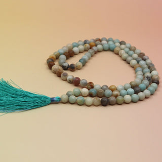 Amazonite 108 Mala Necklace on pink and orange background