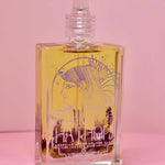 Glass jar of Blue Lotus Oil Ritual with full lotus flower inside