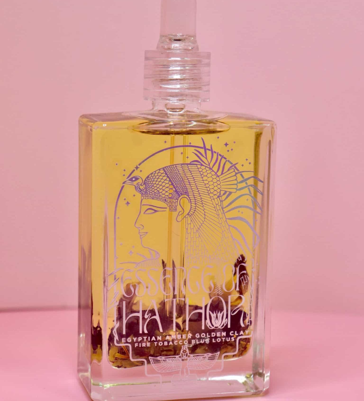 Glass jar of Blue Lotus Oil Ritual with full lotus flower inside