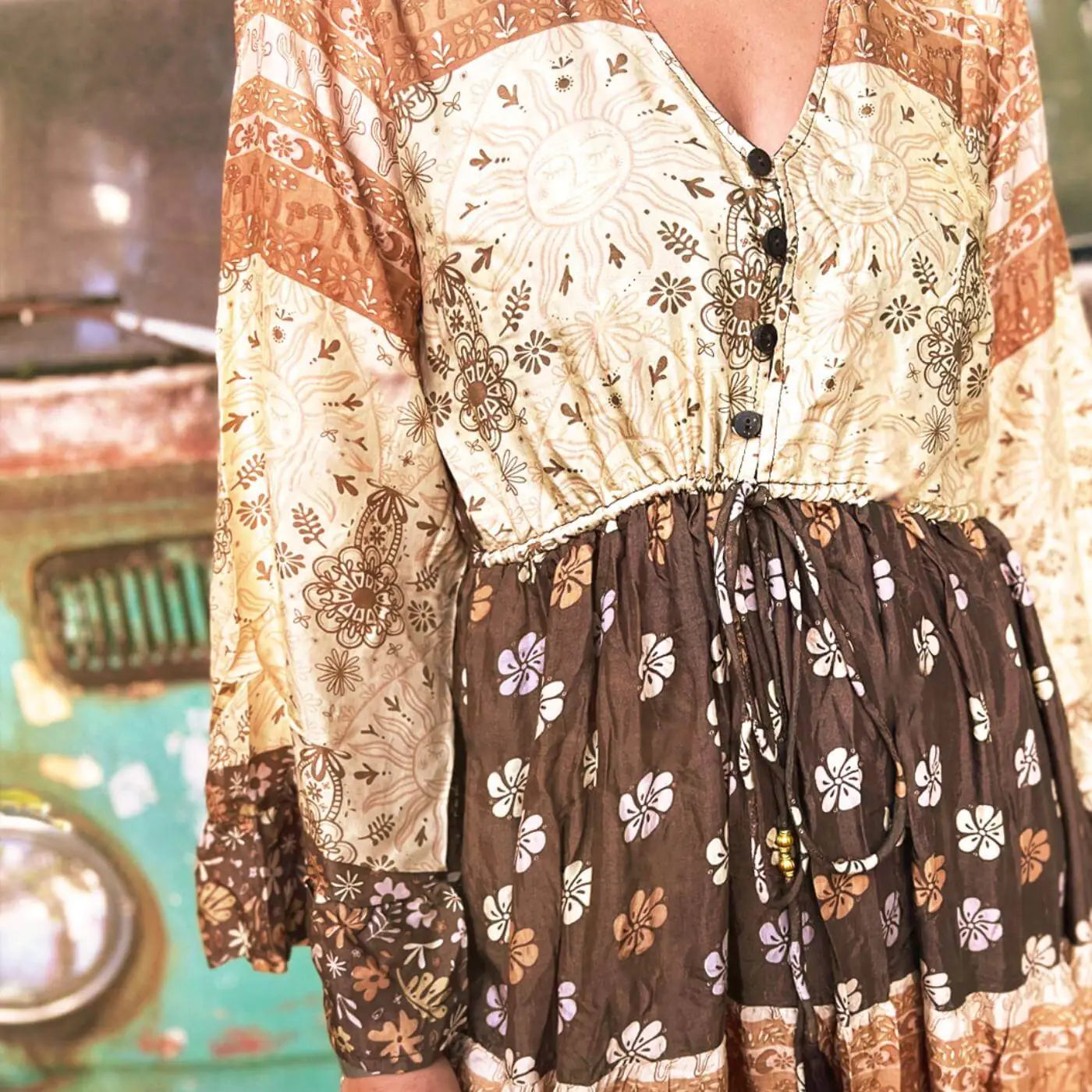 Boho Dress with brown flowers and sun in front of a VW bus