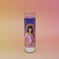 Candle with a portrait of Cher on a gradient background