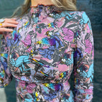 Front view of model wearing Cosmic Mythology Long Sleeve Top with celestial fantasy print