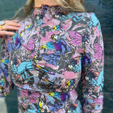 Front view of model wearing Cosmic Mythology Long Sleeve Top with celestial fantasy print