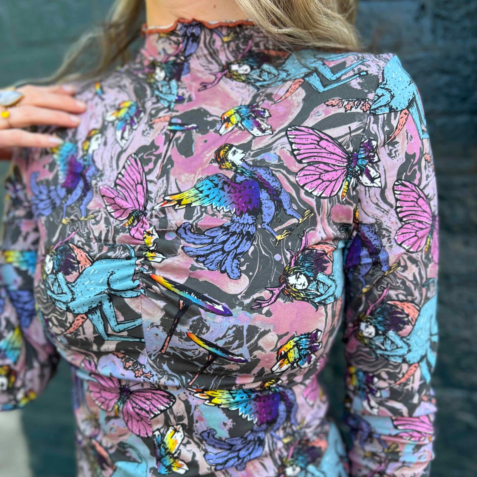 Front view of model wearing Cosmic Mythology Long Sleeve Top with celestial fantasy print