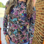 Model showing close-up bust detail and unique artwork on whimsical cotton top