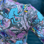 Back view of top featuring blue centaur and butterfly illustrations