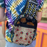 Model wearing boho floral crossbody bag with tie-dye shirt