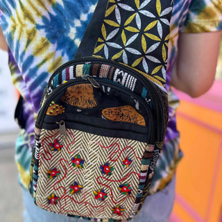 Detail of embroidered front pocket and zip closure