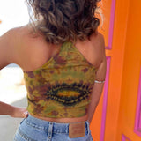 Back view of tie-dye halter crop top showing spiral crystal pattern
