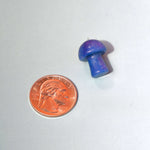 Mini Crystal Gemstone Mushrooms beside US penny for size reference