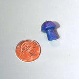 Mini Crystal Gemstone Mushrooms beside US penny for size reference
