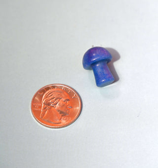 Mini Crystal Gemstone Mushrooms beside US penny for size reference