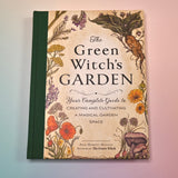 "The Green Witch's Garden" book on a pink and blue background showing the front cover.
