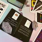 The contents of the Rainbow Brainskull Oracle Deck on a pink and blue background.