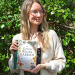 Someone holding the "The Green Witch's Garden" book.