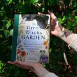 Someone holding the "The Green Witch's Garden" book.