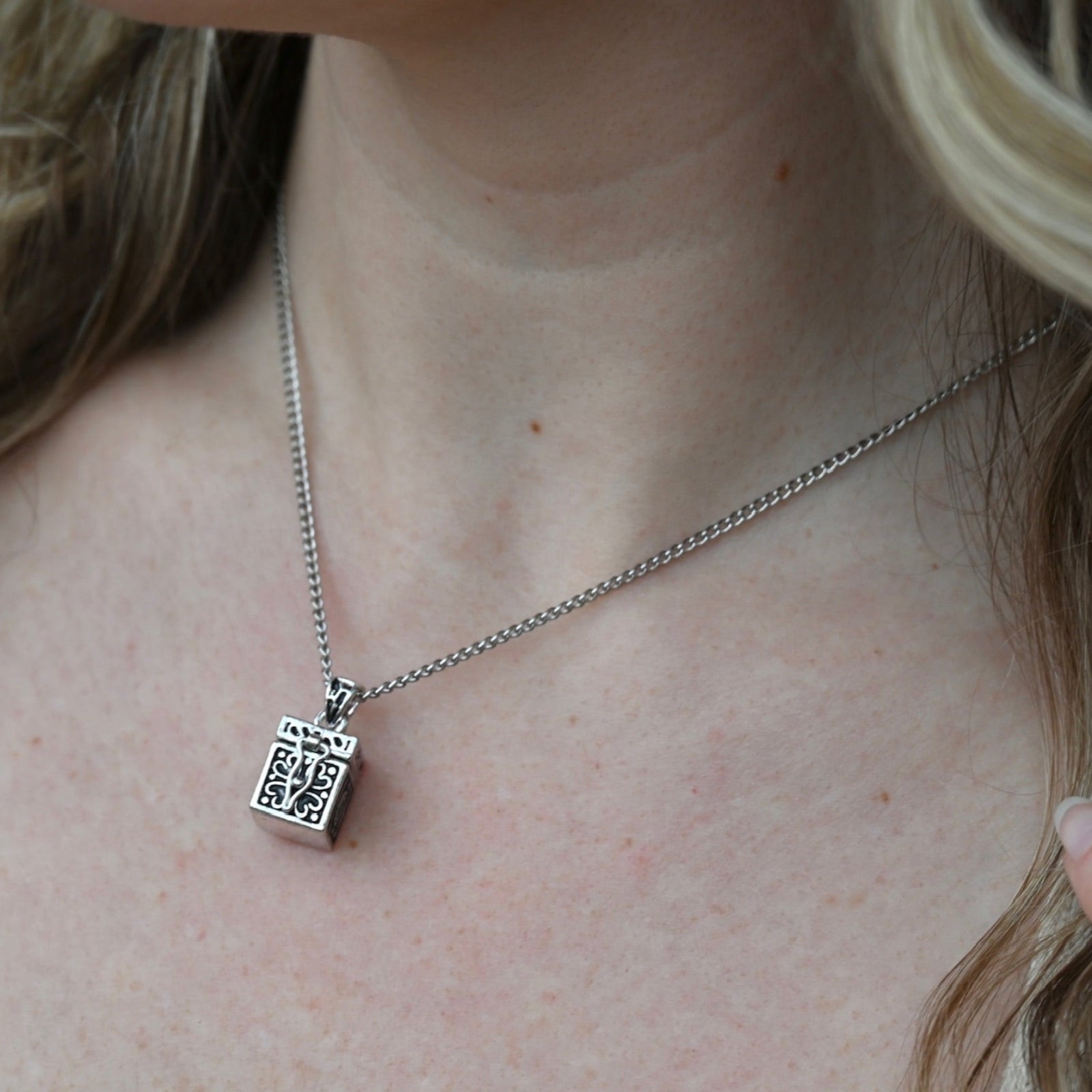 An up-close image of the Vintage Silver Box Locket Necklace being worn.
