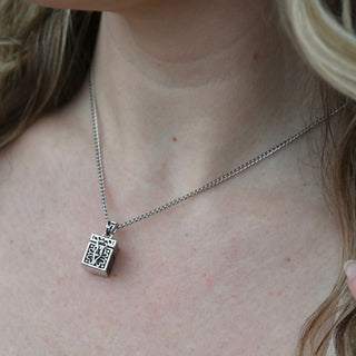 An up-close image of the Vintage Silver Box Locket Necklace being worn.
