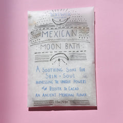 The Mexican Moon Bath Soak Envelope on a pink background.