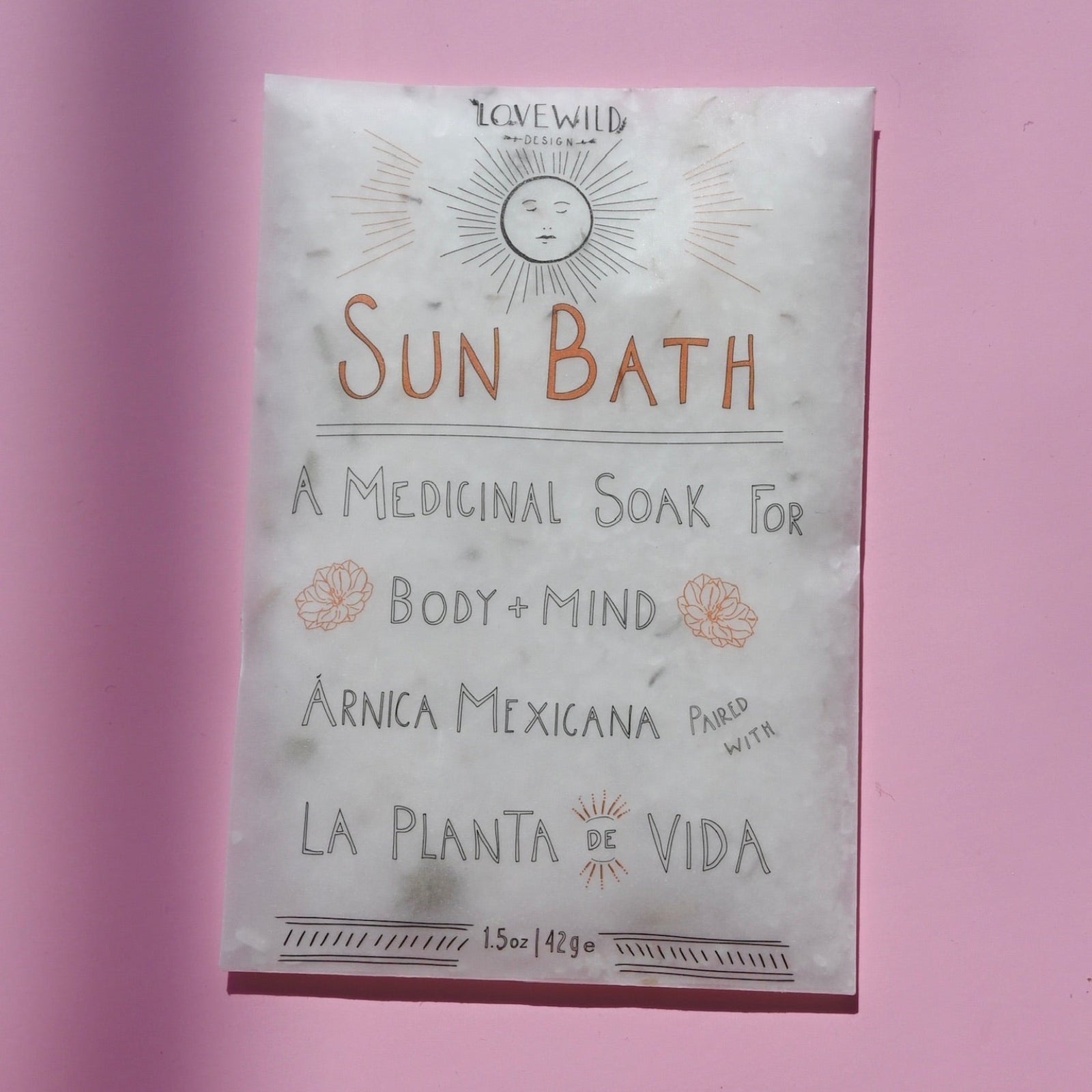 The Sun Bath Medicinal Soak on a pink background.