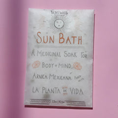 The Sun Bath Medicinal Soak on a pink background.