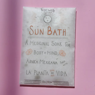 The Sun Bath Medicinal Soak on a pink background.