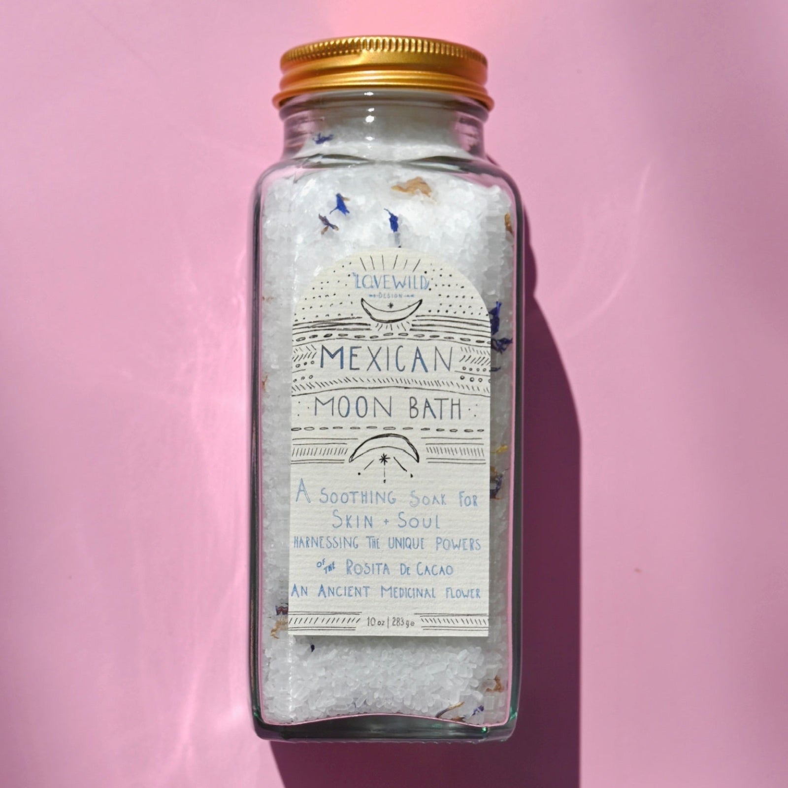 The Mexican Moon Bath Soak on a pink background.