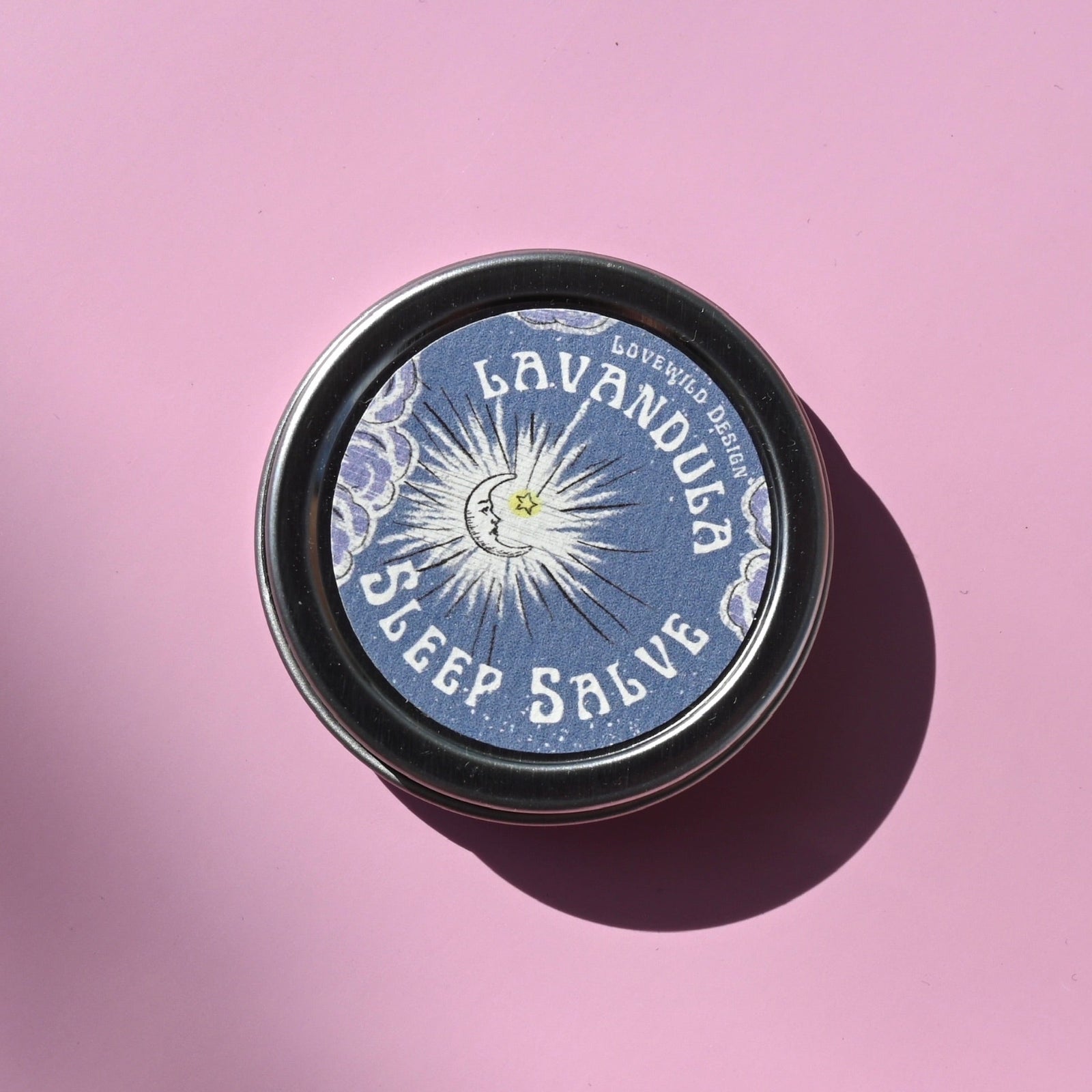The Lavandula Sleep Salve on a pink background.