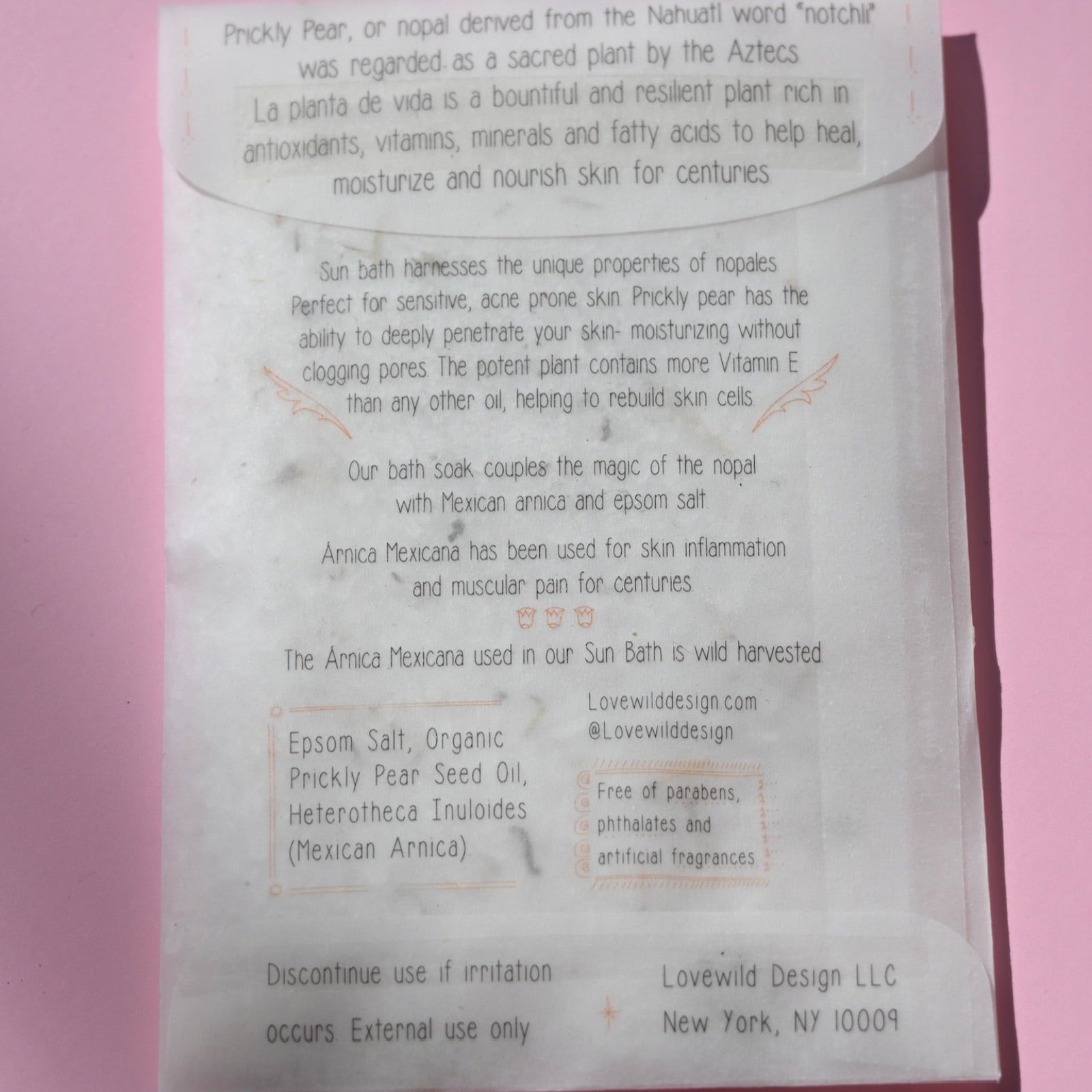 The back of the Sun Bath Medicinal Soak on a pink background.
