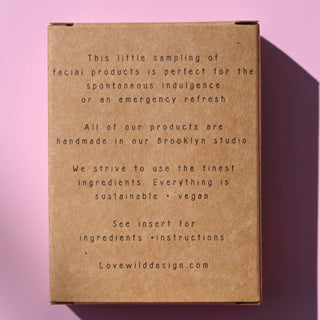 The back of the Mini Facial Kit on a pink background.