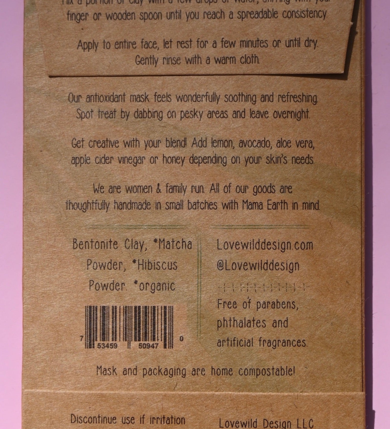 The back of the Antioxidant Mask on a pink background.